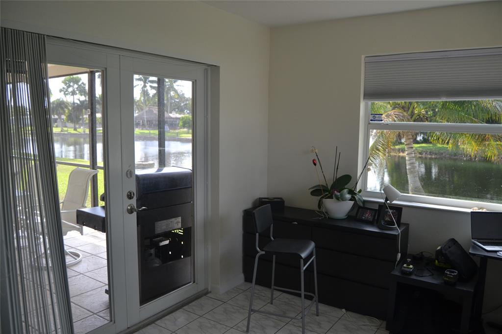 5241 Southwest 89th Avenue Cooper City, FL 33328 - Photo 21 of 28 a view of a workspace with furniture and a window