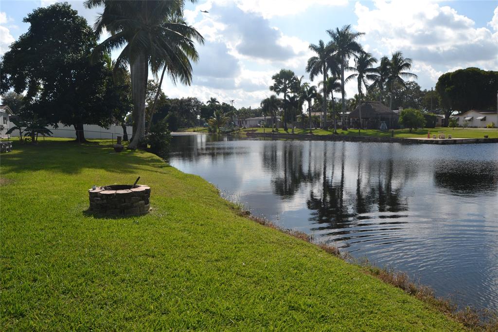 5241 Southwest 89th Avenue Cooper City, FL 33328 - Photo 26 of 28 a lake with palm trees
