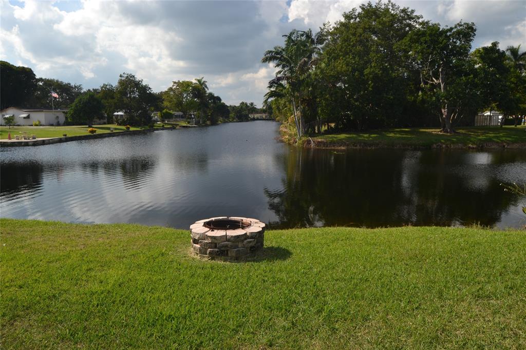 5241 Southwest 89th Avenue Cooper City, FL 33328 - Photo 27 of 28 a view of a lake with houses in back