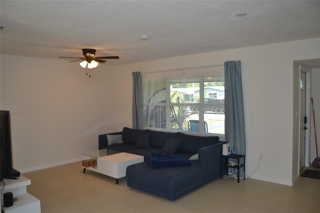 5241 Southwest 89th Avenue Cooper City, FL 33328 - Photo 8 of 28 a living room with furniture and a window