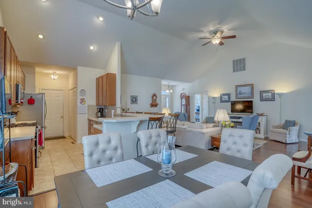 a view of a livingroom with workspace and a window