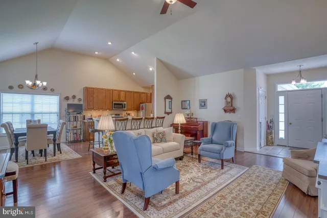 a view of a livingroom with workspace and a bookshelf