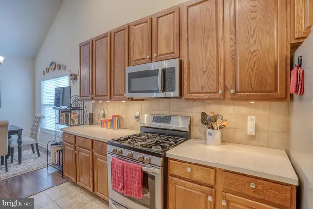 a view of a house with a yard and garden