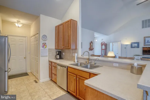 an aerial view of a house with garden space and street view