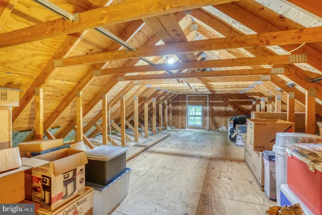 an aerial view of a residential houses with outdoor space and street view