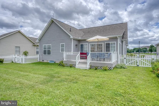 a view of a house with a tree in a yard