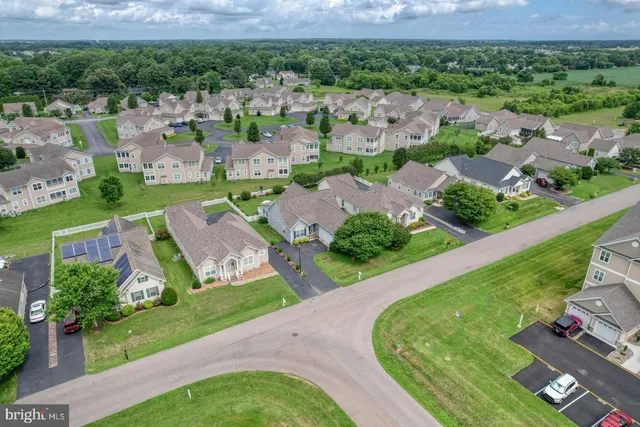a front view of a house with a big yard