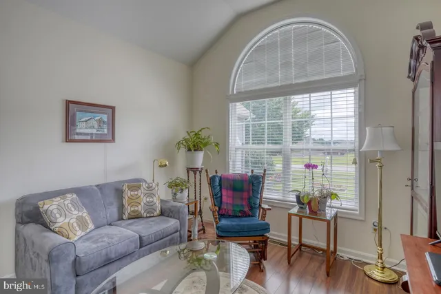 a bedroom with a bed cabinets and a window