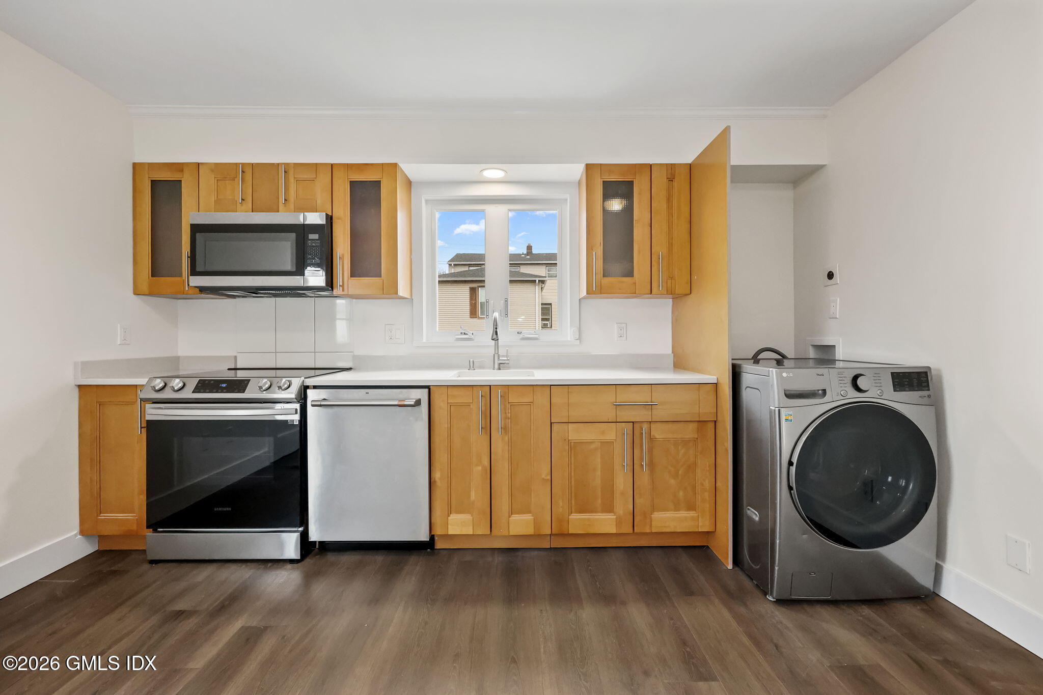 2 Grange Street Greenwich, CT 06830 - Photo 18 of 31 a kitchen with stainless steel appliances granite countertop a stove a microwave and a sink