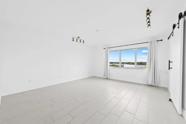 a view of a refrigerator and window