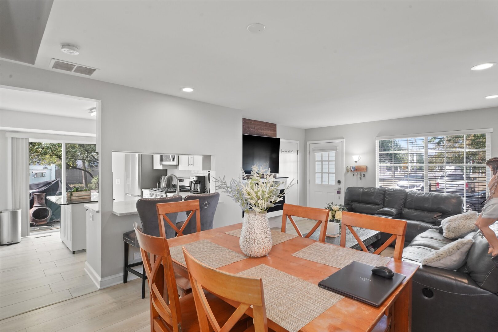 1334 Normantown Road Naperville, IL 60564 - Photo 4 of 19 a dining room with furniture a large window and a chandelier