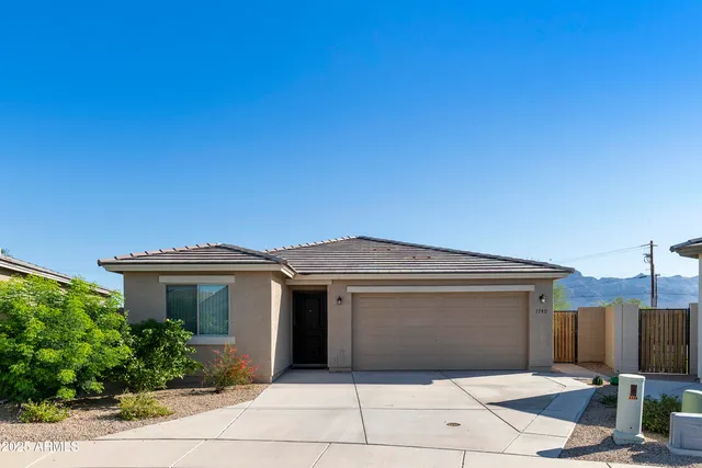 a front view of a house with a garage