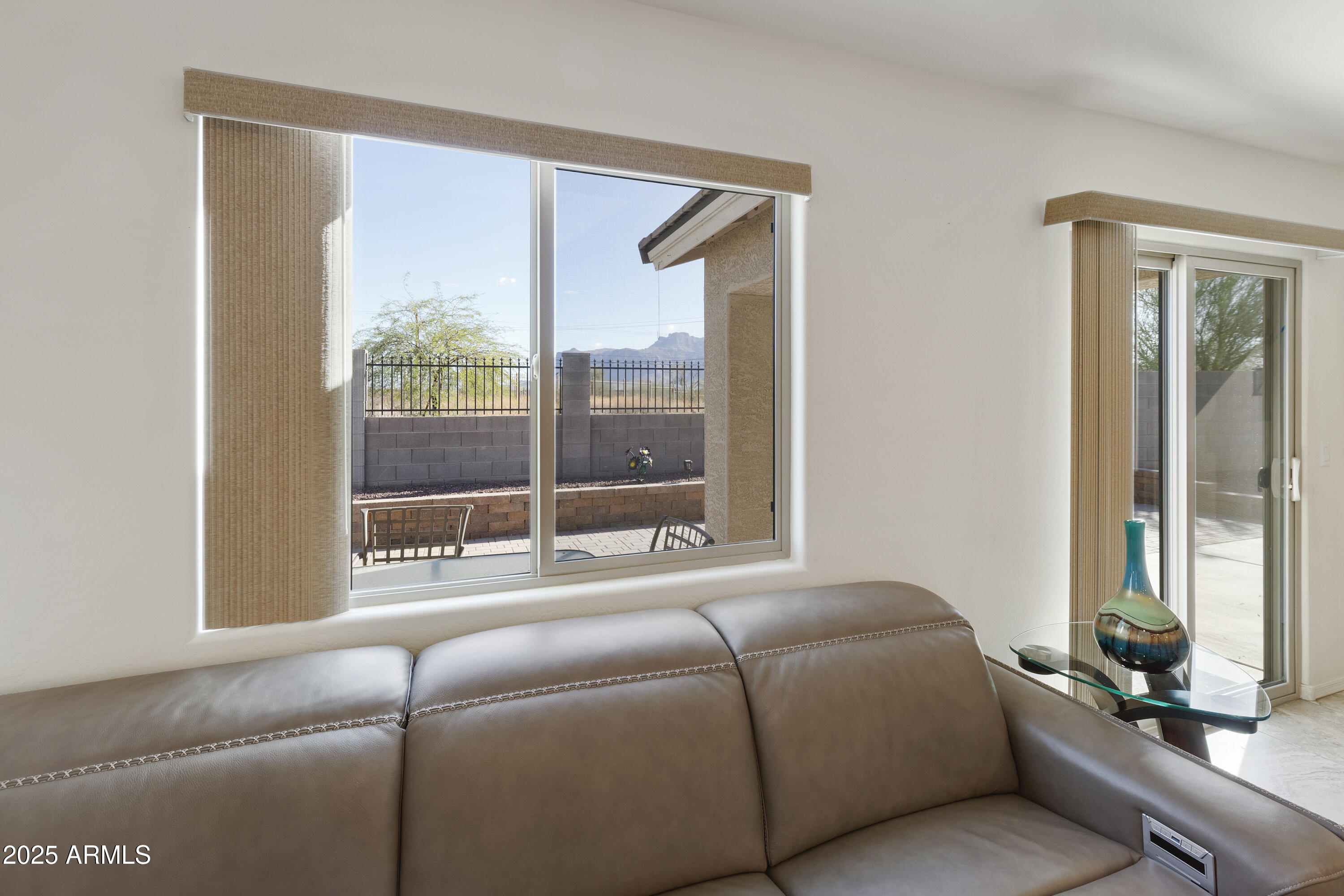 1740 East 16th Avenue Apache Junction, AZ 85119 - Photo 12 of 27 a living room with couch next to a window