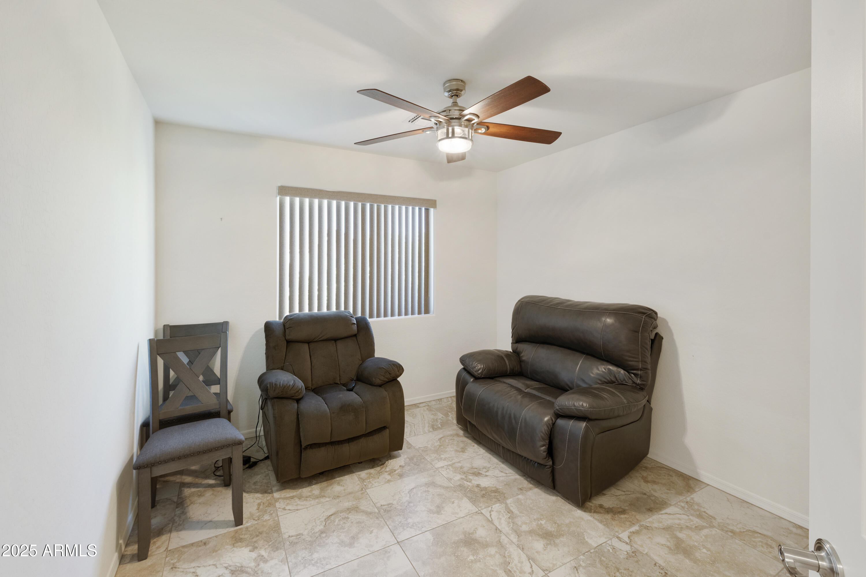1740 East 16th Avenue Apache Junction, AZ 85119 - Photo 19 of 27 a living room with furniture and a ceiling fan