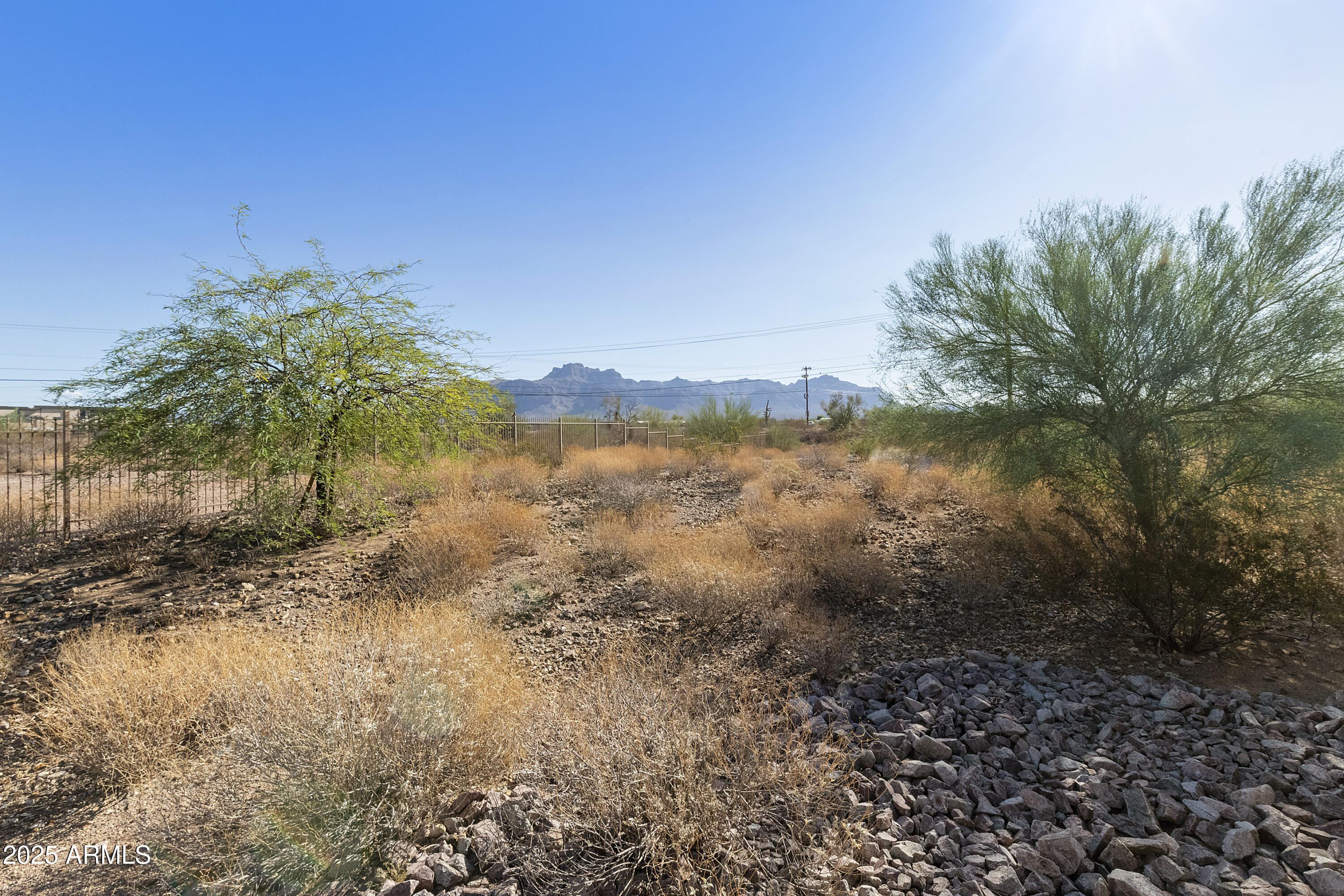 1740 East 16th Avenue Apache Junction, AZ 85119 - Photo 25 of 27 a view of a lake with a mountain in the background