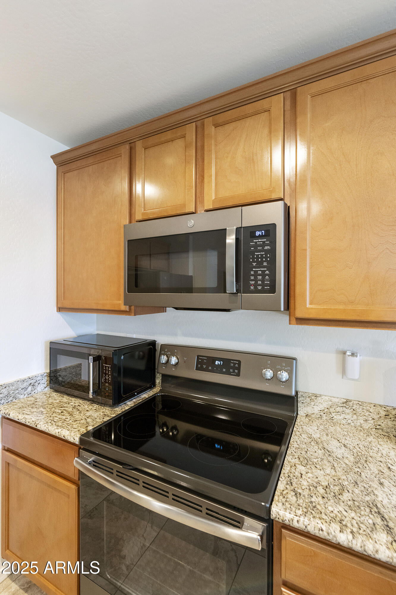 1740 East 16th Avenue Apache Junction, AZ 85119 - Photo 8 of 27 a view of kitchen with granite countertop stainless steel appliances and a sink