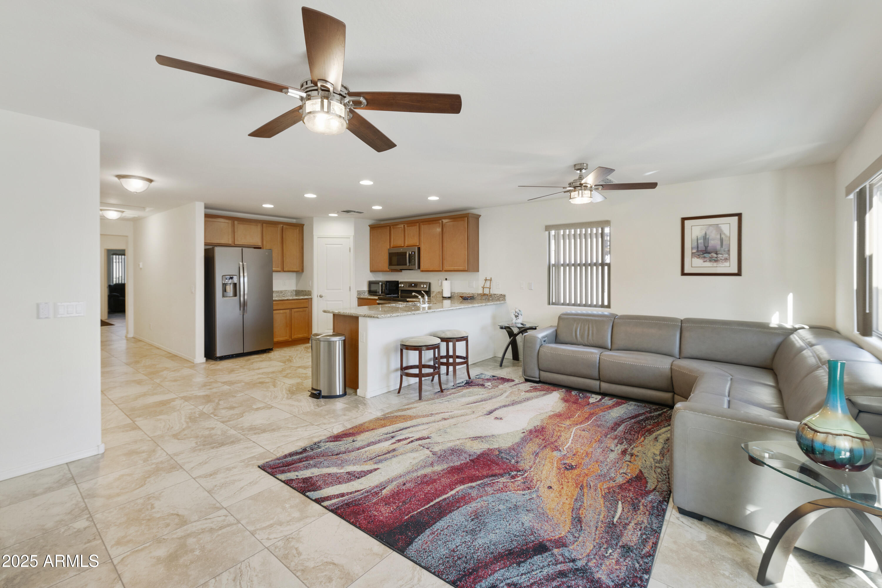 1740 East 16th Avenue Apache Junction, AZ 85119 - Photo 10 of 27 a living room with furniture and kitchen view