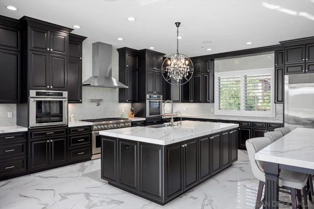 14445 Cheyenne Trail Poway, CA 92064 - Photo 9 of 62 a kitchen with stainless steel appliances a sink stove and refrigerator