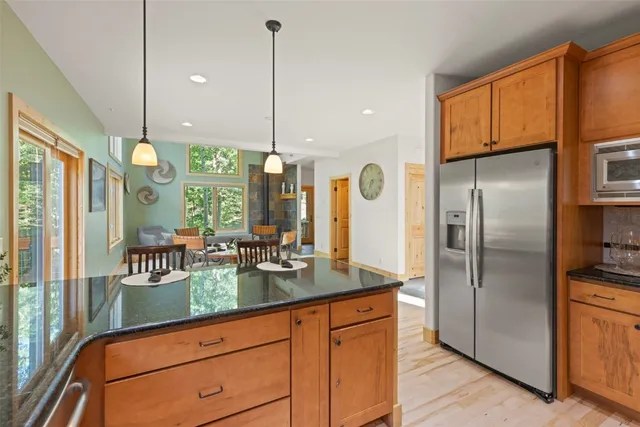 a kitchen with counter top space cabinets and stainless steel appliances