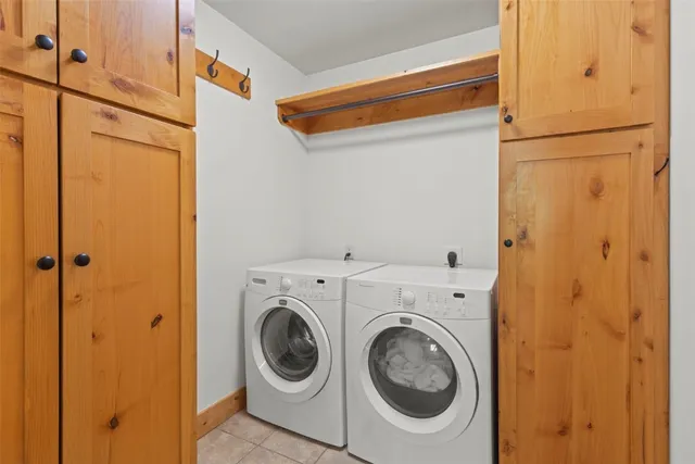 a bedroom with a bed and a potted plant