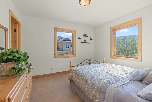 a bedroom with a bed and a dresser in it