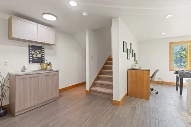 a view of entryway with wooden floor and staircase