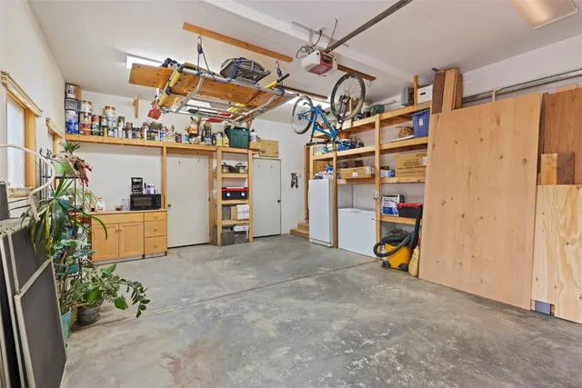 a patio with glass windows and table