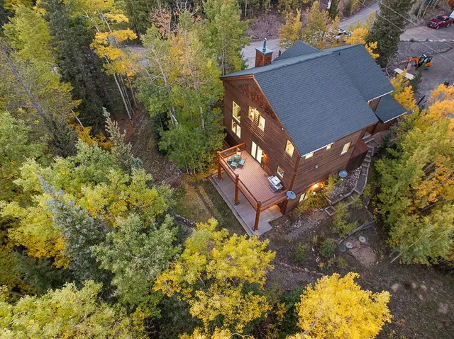 a aerial view of a house with a yard and garden