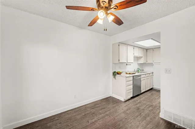 a kitchen with a sink cabinets and window