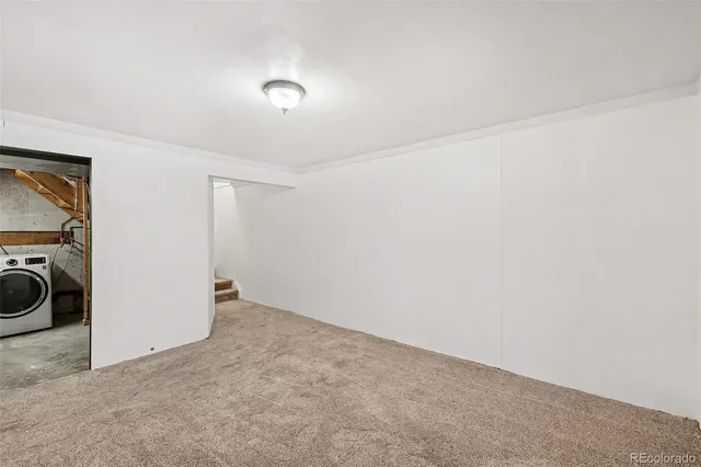 a view of a storage & utility room with a sink