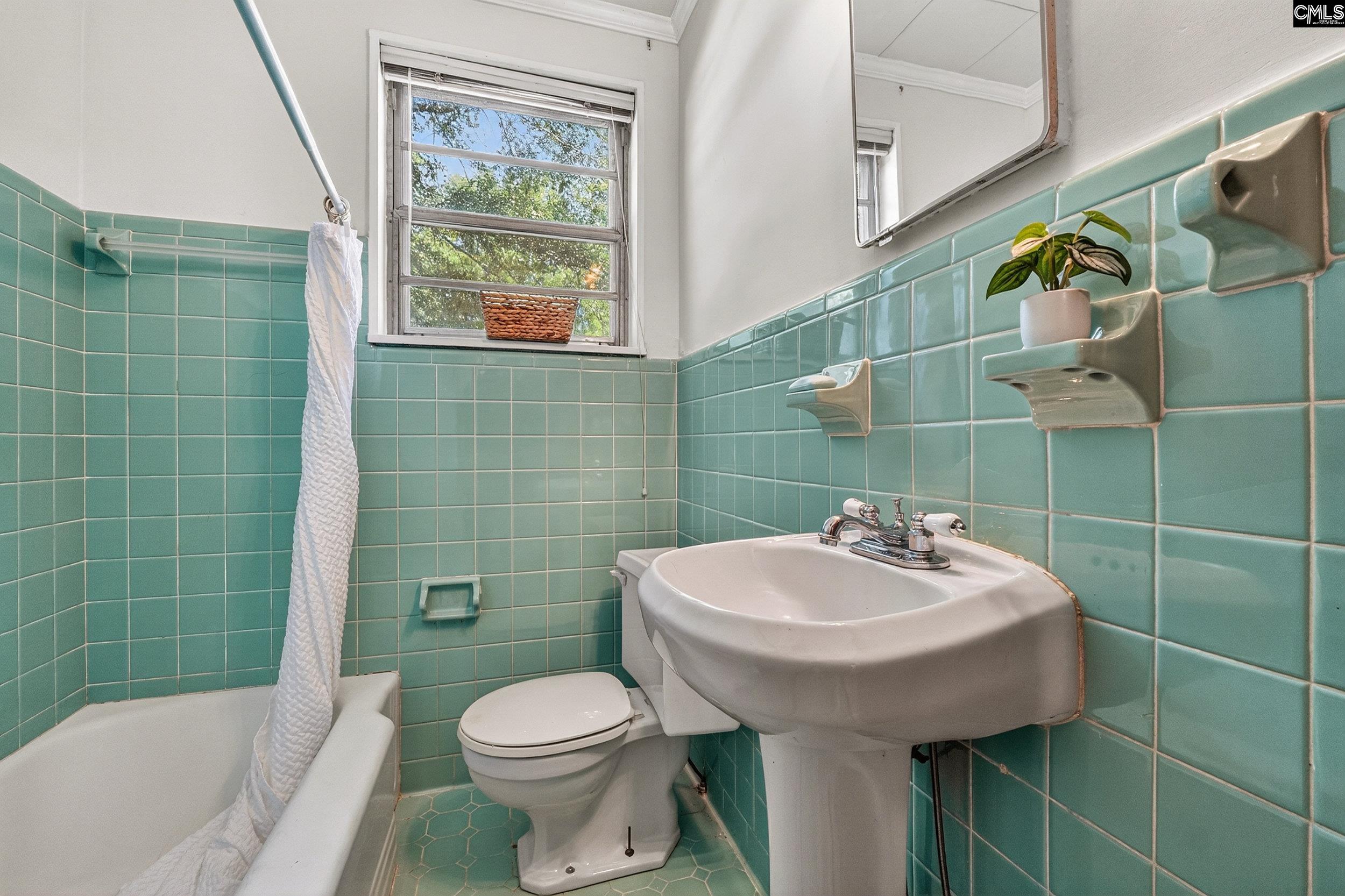 729 Magnolia Street Pelion, SC 29123 - Photo 17 of 32 a bathroom with a sink toilet and shower