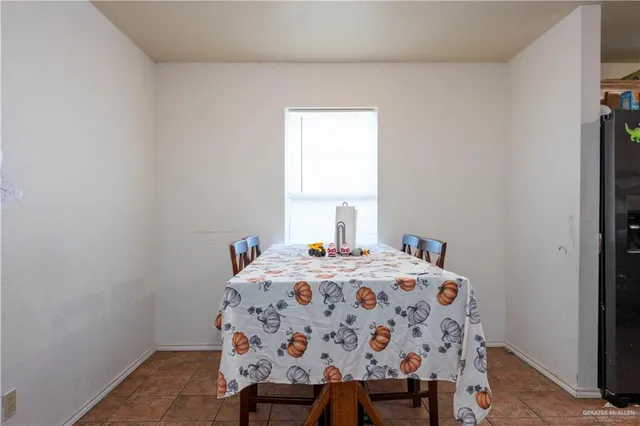 a bedroom with a bed and a table in it