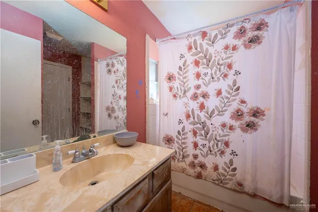 a bathroom with a sink and a mirror