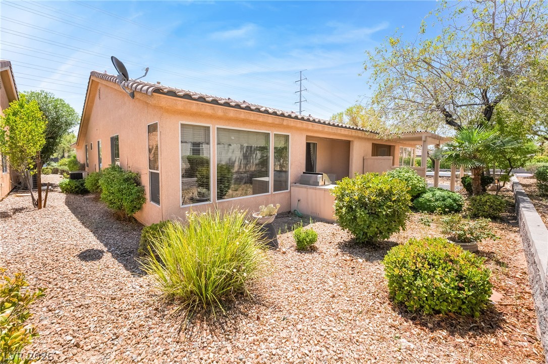 5389 Progresso Street Las Vegas, NV 89135 - Photo 29 of 41 A well-maintained desert landscape embraces this inviting property, featuring a covered patio for outdoor enjoyment.