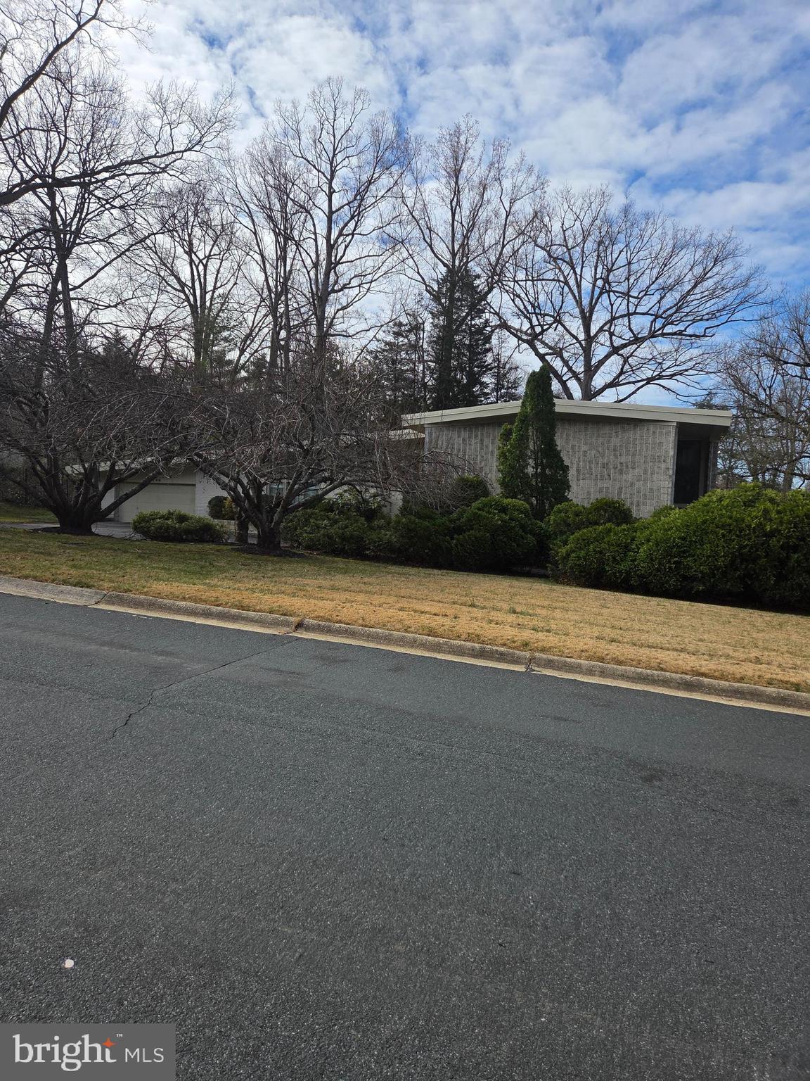 7146 River Road Bethesda, MD 20817 - Photo 2 of 2 a view of a house with a yard and garage