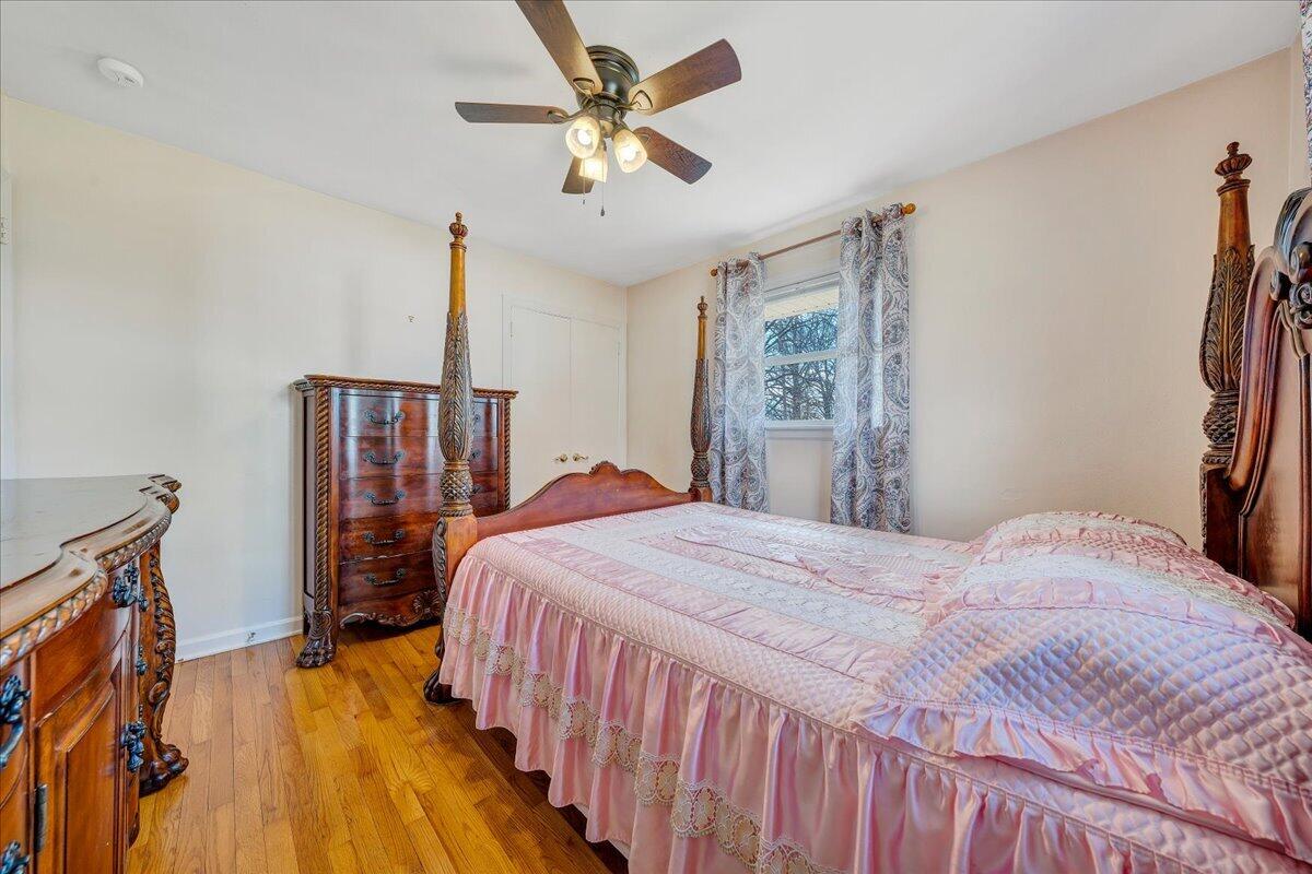1707 Glendon Road Salem, VA 24153 - Photo 13 of 41 a bedroom with a bed and a chandelier