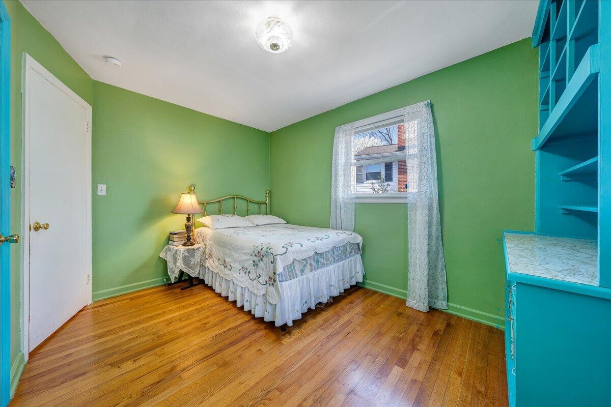 1707 Glendon Road Salem, VA 24153 - Photo 15 of 41 a bedroom with a bed and a wooden floor