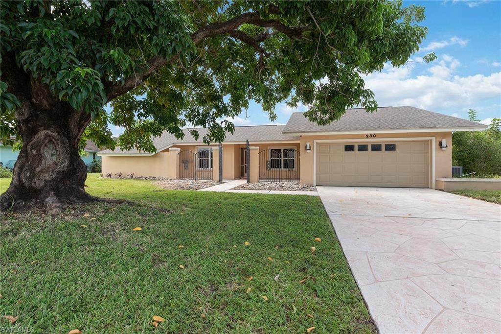 a view of a house with a backyard