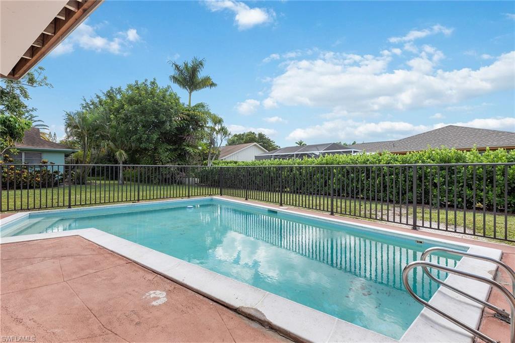 280 Baltusrol Drive Naples, FL 34113 - Photo 11 of 13 a view of a terrace with a lake view