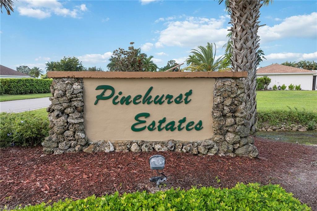280 Baltusrol Drive Naples, FL 34113 - Photo 13 of 13 a sign that is sitting on the ground
