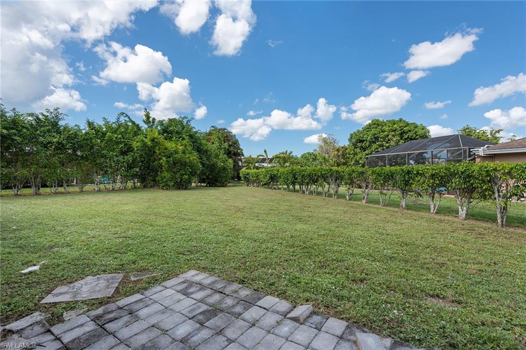 280 Baltusrol Drive Naples, FL 34113 - Photo 9 of 13 a view of a golf course with a lake