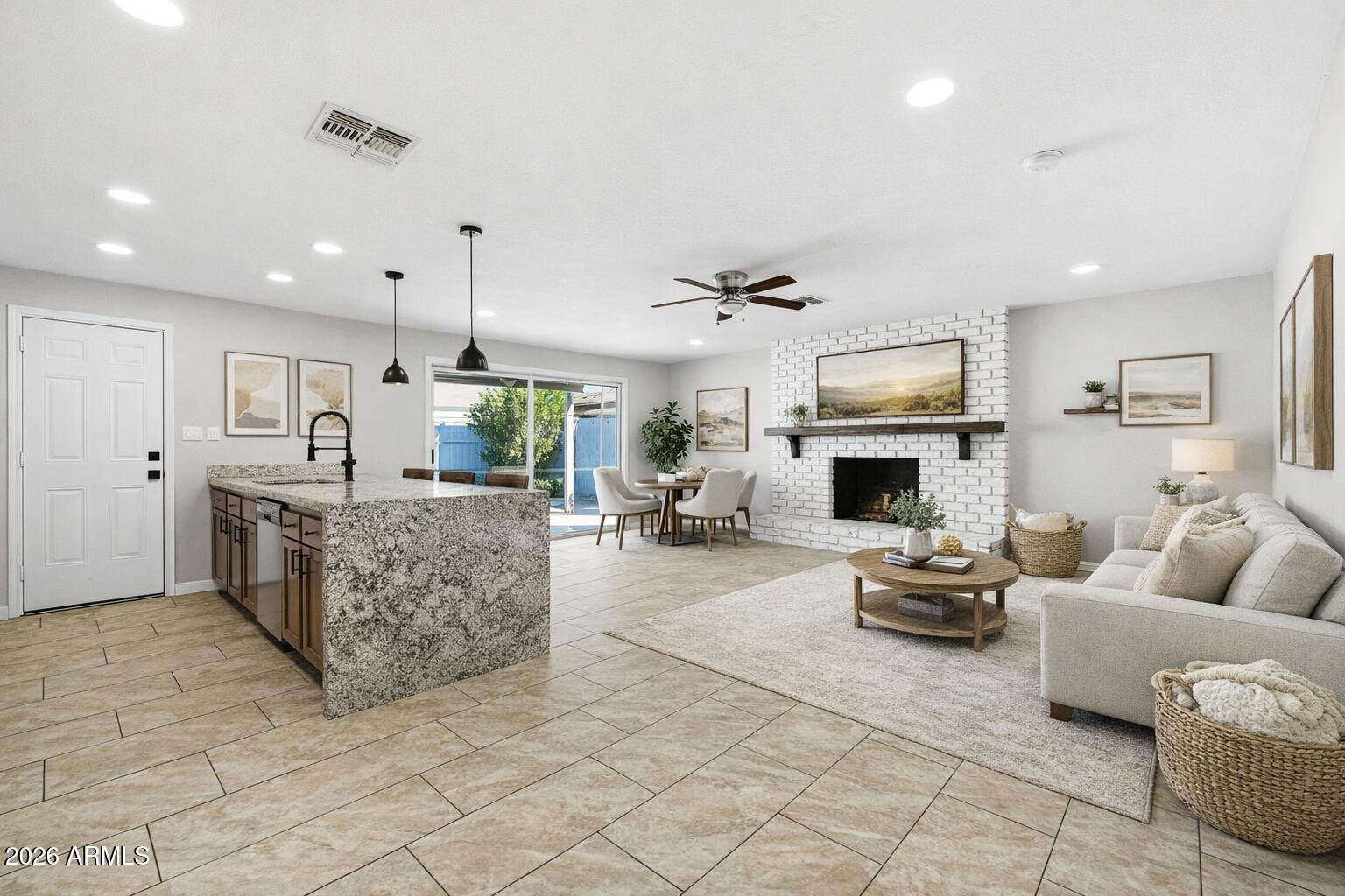 1726 West Royal Palm Road Phoenix, AZ 85021 - Photo 4 of 20 a living room with furniture and a fireplace