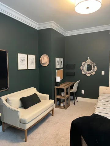 a bedroom with a bed and a table in it