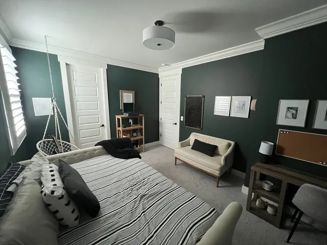 a bedroom with furniture and a wooden floor