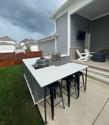 a kitchen with a table chairs and a stove