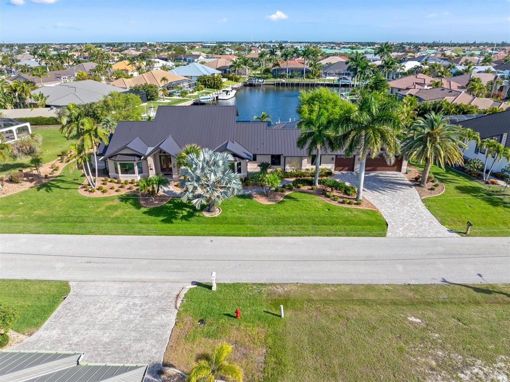 an aerial view of a house with a yard