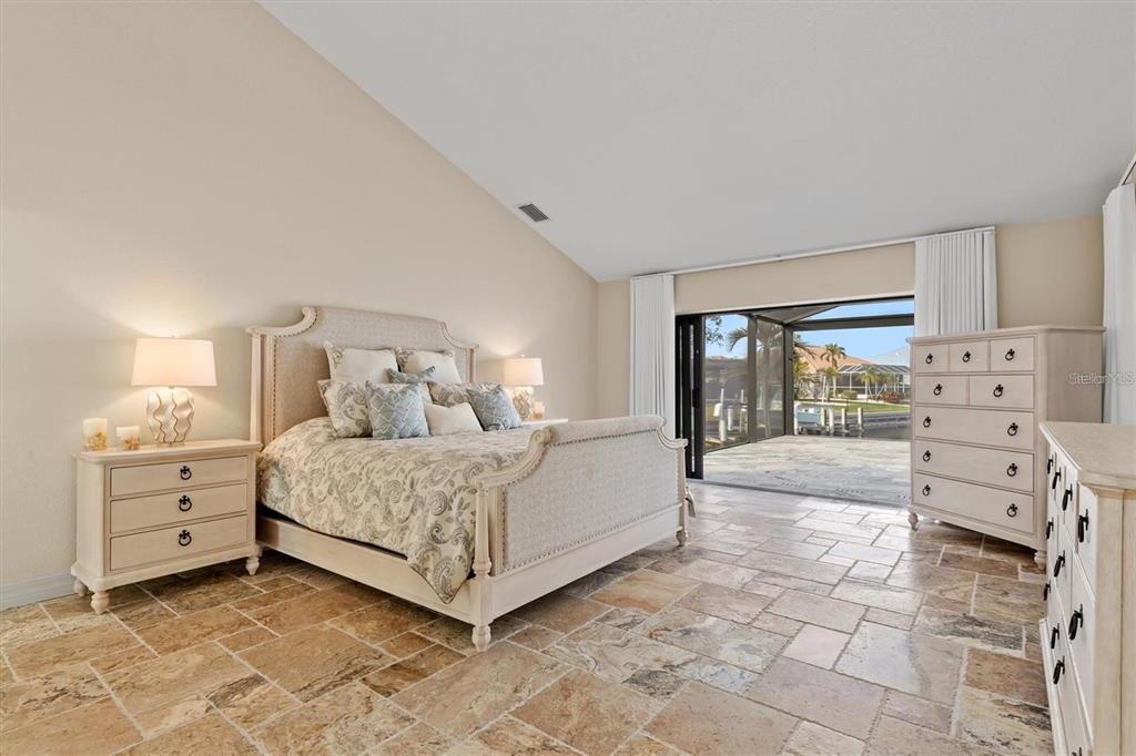 1701 Casey Key Drive Punta Gorda, FL 33950 - Photo 14 of 58 a room with a bed and a view of bedroom