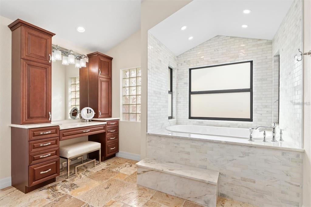 1701 Casey Key Drive Punta Gorda, FL 33950 - Photo 19 of 58 a large bathroom with a large tub sink and mirror