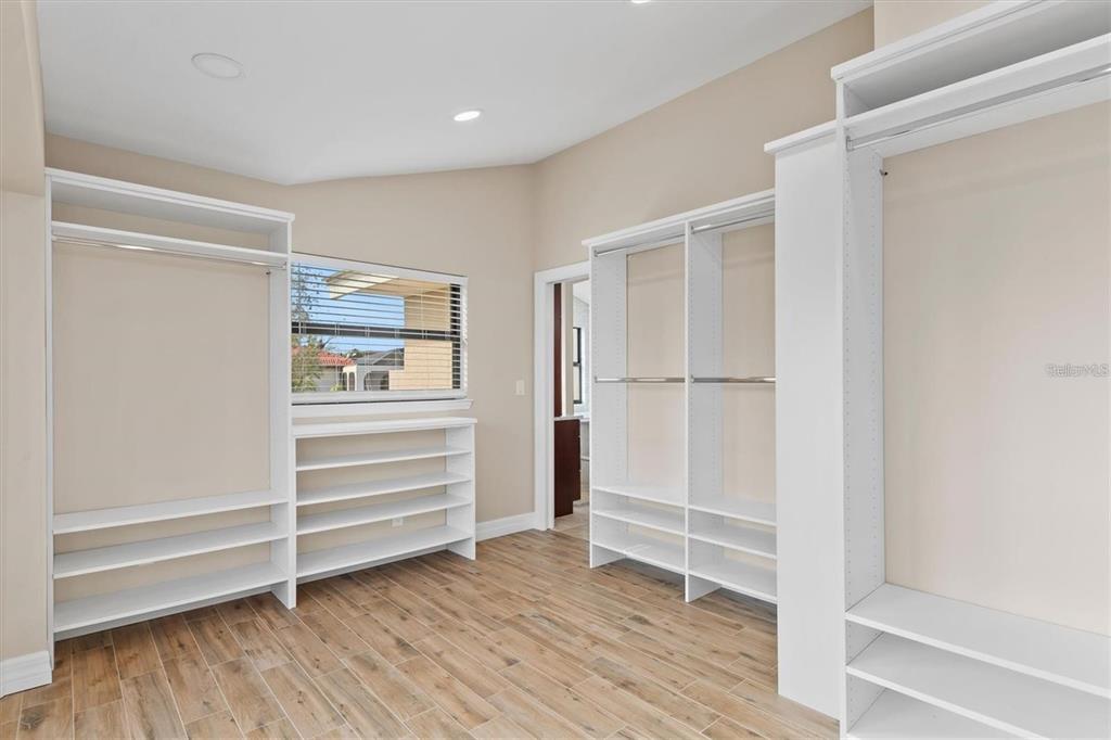 1701 Casey Key Drive Punta Gorda, FL 33950 - Photo 22 of 58 a view of walk in closet with empty racks