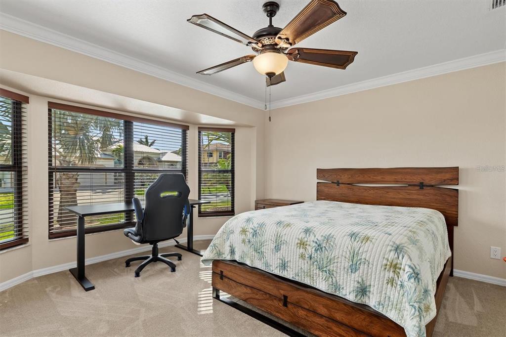 1701 Casey Key Drive Punta Gorda, FL 33950 - Photo 23 of 58 a bedroom with a bed and a large window